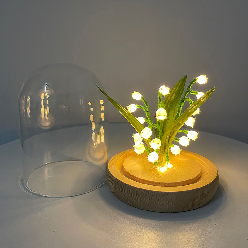 Glass Garden Lamp in a Garden Setting - An elegant glass lamp casting a soft, inviting glow in your garden, perfect for creating an enchanting outdoor atmosphere.