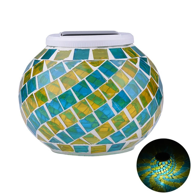 Solar Glass Light in Garden - An eco-friendly garden light, powered by the sun and featuring a glass design, perfect for adding a warm and inviting glow to your outdoor sanctuary.