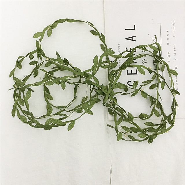 Leaf rattan light string illuminating outdoor space