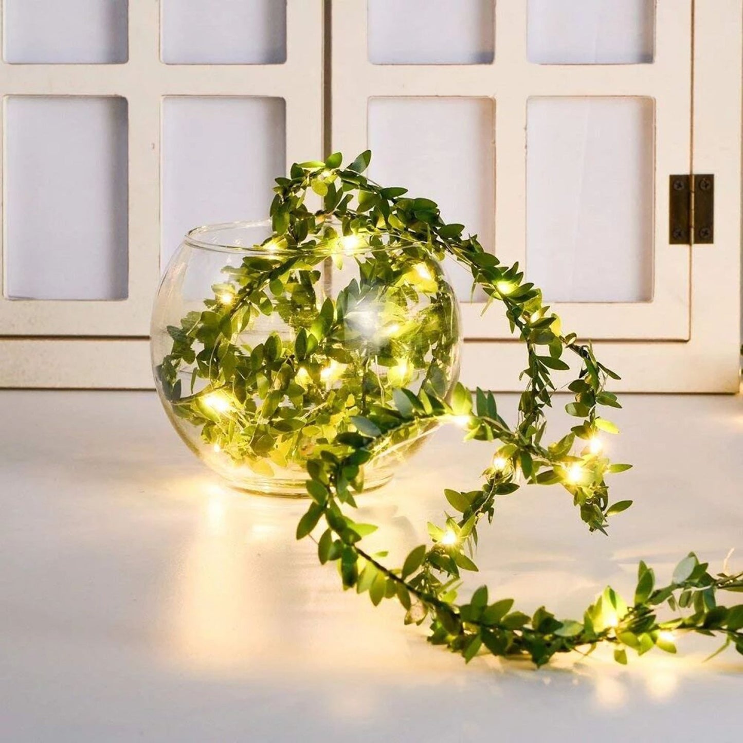 Leaf rattan light string illuminating outdoor space