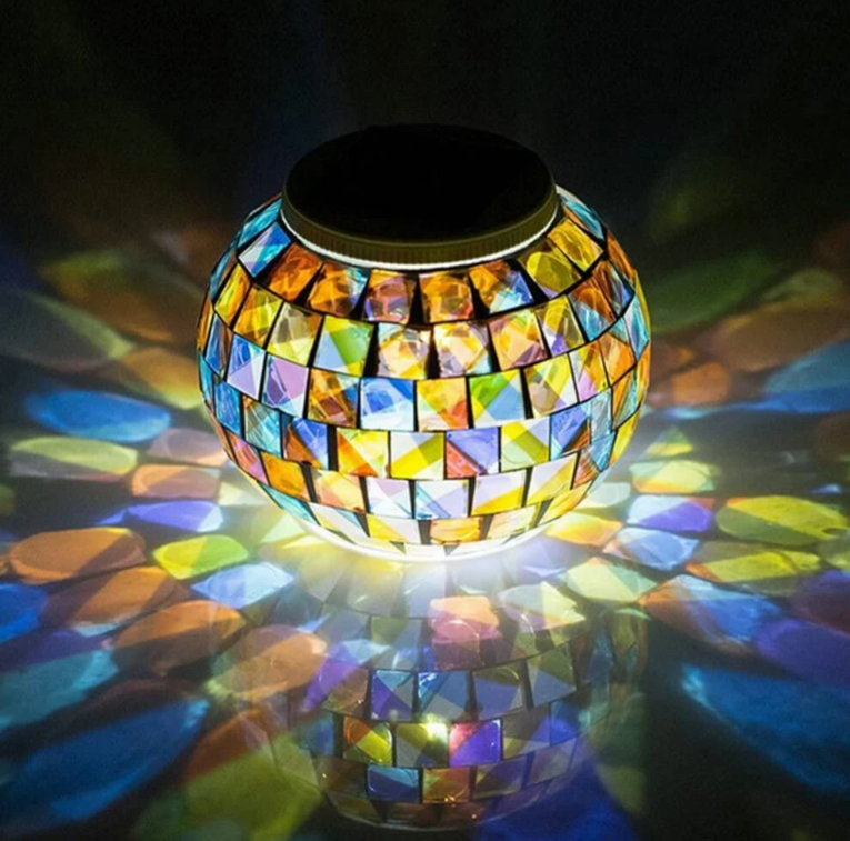 Solar Glass Light in Garden - An eco-friendly garden light, powered by the sun and featuring a glass design, perfect for adding a warm and inviting glow to your outdoor sanctuary.