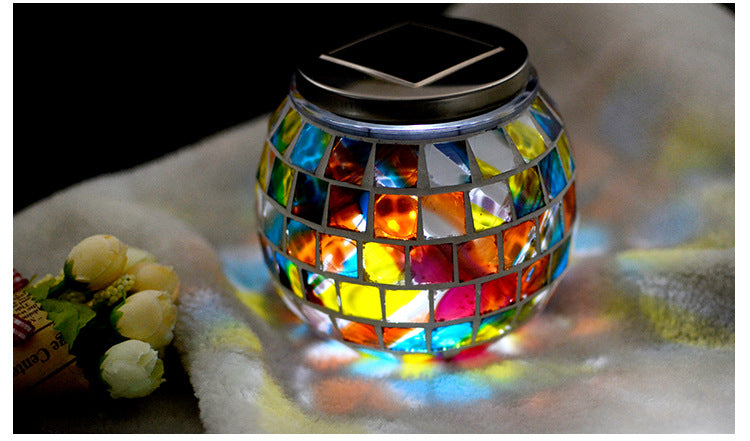 Solar Glass Light in Garden - An eco-friendly garden light, powered by the sun and featuring a glass design, perfect for adding a warm and inviting glow to your outdoor sanctuary.