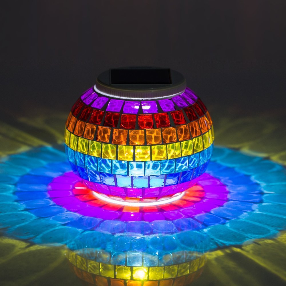 Solar Glass Light in Garden - An eco-friendly garden light, powered by the sun and featuring a glass design, perfect for adding a warm and inviting glow to your outdoor sanctuary.