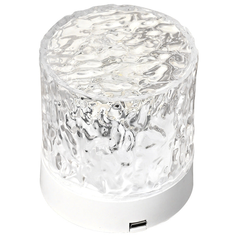 Contemporary Atmosphere Night Light emitting a soft and calming glow, perfect for setting a relaxed ambiance in any room. The light is designed with a sleek and minimalist aesthetic, and is displayed on a bedside table, highlighting its modern and versatile design.