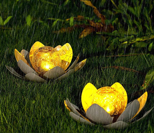 Solar Lotus Light in Garden - A stunning lotus-shaped solar light, blossoming with beauty in your garden, harnessing the power of the sun to illuminate your outdoor haven.
