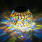Solar Glass Light in Garden - An eco-friendly garden light, powered by the sun and featuring a glass design, perfect for adding a warm and inviting glow to your outdoor sanctuary.