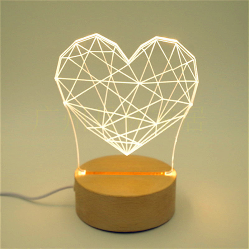 Stunning 3D Wooden Lamp featuring intricate laser-cut design, casting a beautiful pattern of light and shadows when illuminated. The lamp is made from natural wood, adding a warm and rustic touch to any room, and is displayed on a wooden table to highlight its elegant design.