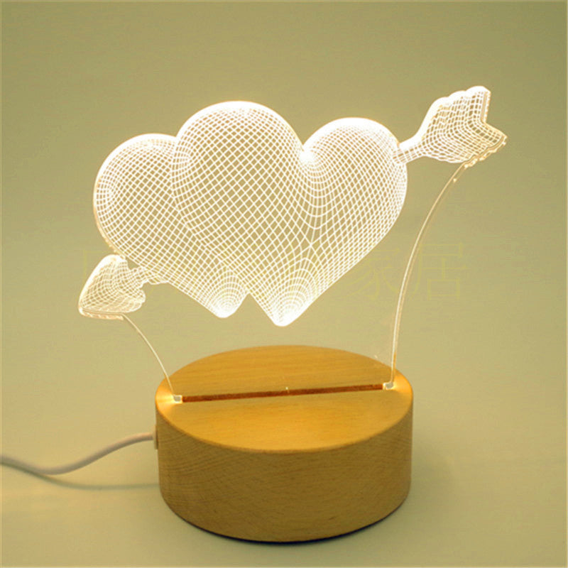 Stunning 3D Wooden Lamp featuring intricate laser-cut design, casting a beautiful pattern of light and shadows when illuminated. The lamp is made from natural wood, adding a warm and rustic touch to any room, and is displayed on a wooden table to highlight its elegant design.