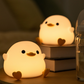 Charming Seagull Night Light crafted in the shape of a seagull, emitting a soft and comforting glow. The light is made from high-quality materials and is displayed against a neutral background, highlighting its intricate design and the calming ambiance it brings to any room.