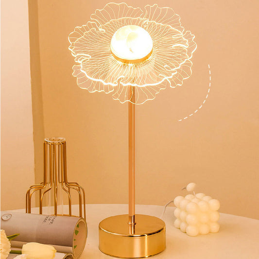 Charming Fairy Table Lamp featuring a delicate design with fairy silhouette cutouts, casting a warm and whimsical pattern of light and shadows when illuminated. The lamp is displayed on a wooden table, enhancing its magical and enchanting appeal.
