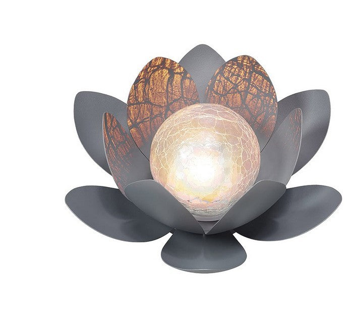 Solar Lotus Light in Garden - A stunning lotus-shaped solar light, blossoming with beauty in your garden, harnessing the power of the sun to illuminate your outdoor haven.